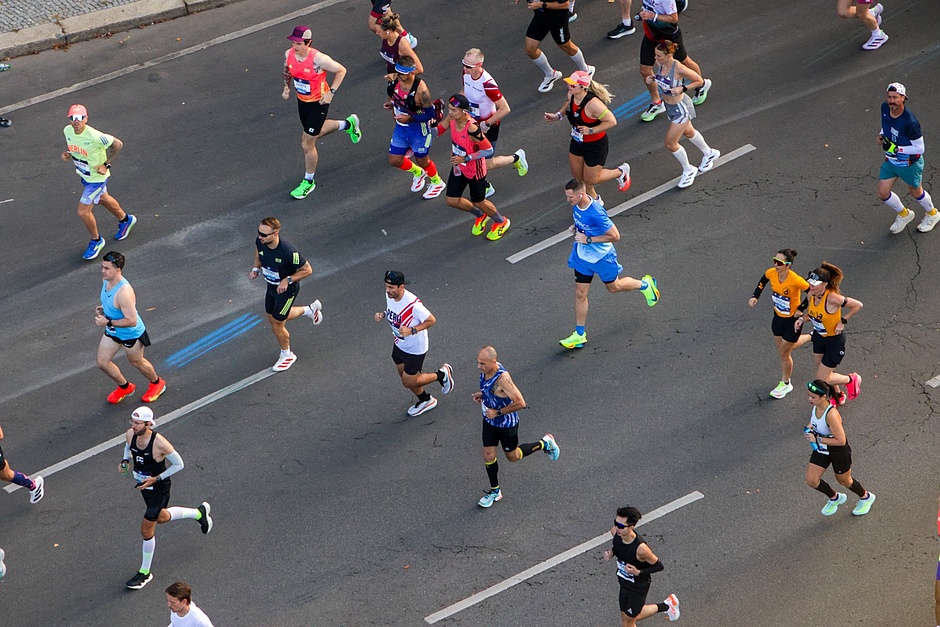 About 20 runners, seen from above on the course.